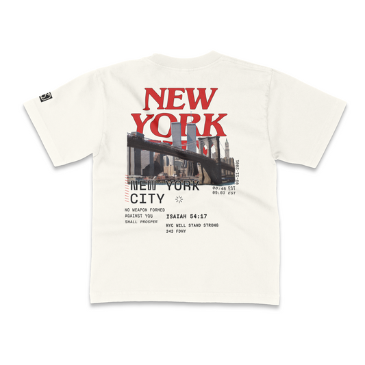 White t-shirt with 'New York City' 9-11 tribute graphic and text on a white background. 